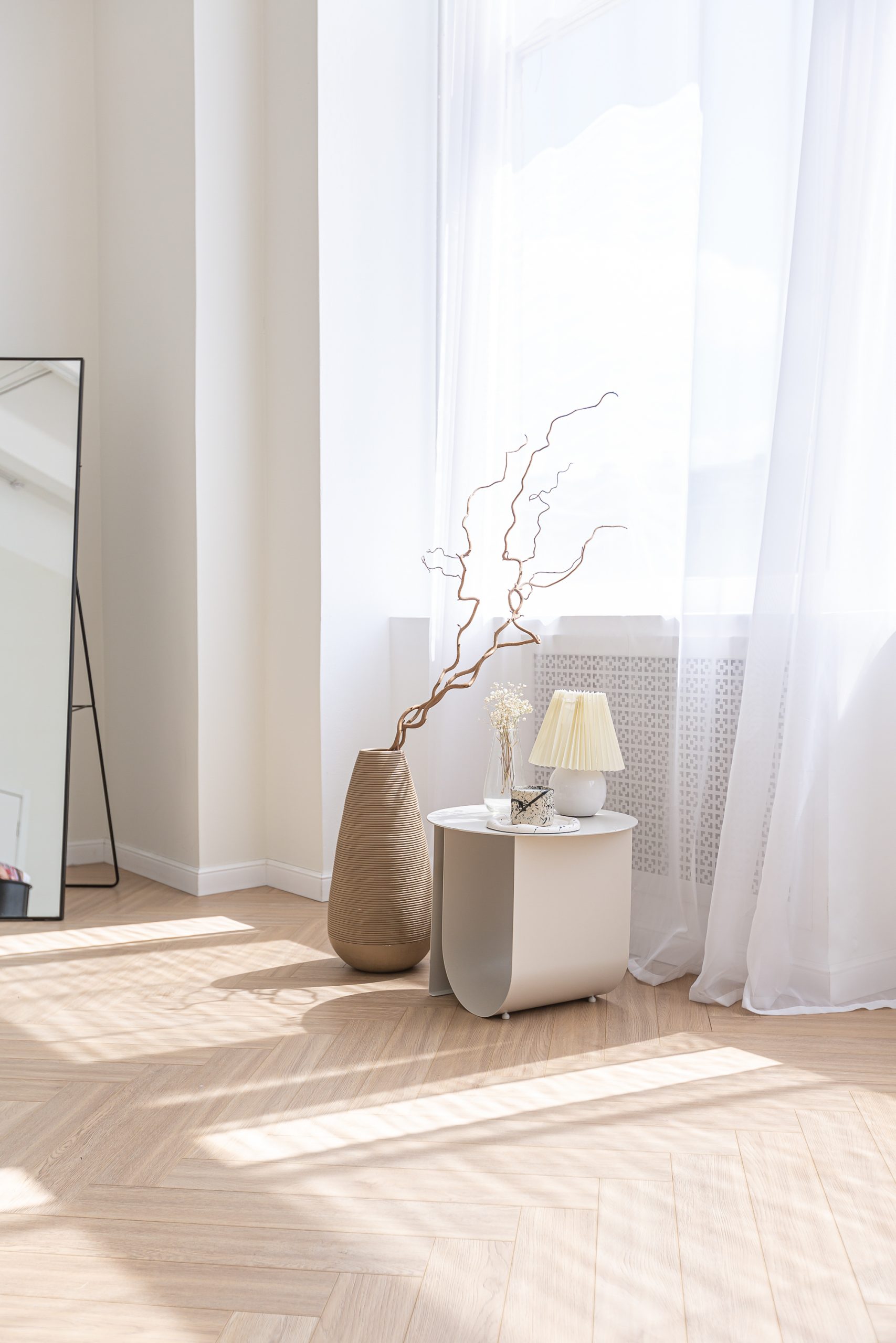super white simple clean and stylish interior with modern furniture in nude color and contrasting black elements. luxury design of a large bright room living room