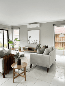 Staging a house for sale with professional furniture and styling to enhance buyer appeal and showcase the home’s layout