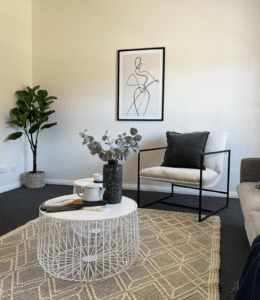 Modern living room styled for vacant home staging in Melbourne featuring neutral furniture, artwork and décor to enhance buyer appeal.