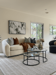 Occupied home staging Melbourne living room styled with modern furniture and neutral décor to prepare a lived-in property for sale